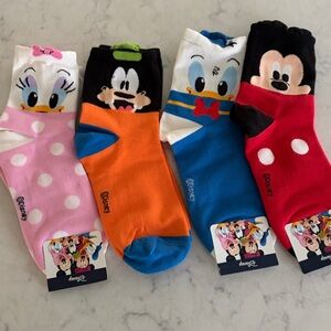 Woman’s Disney Socks.  4 pairs, all new.